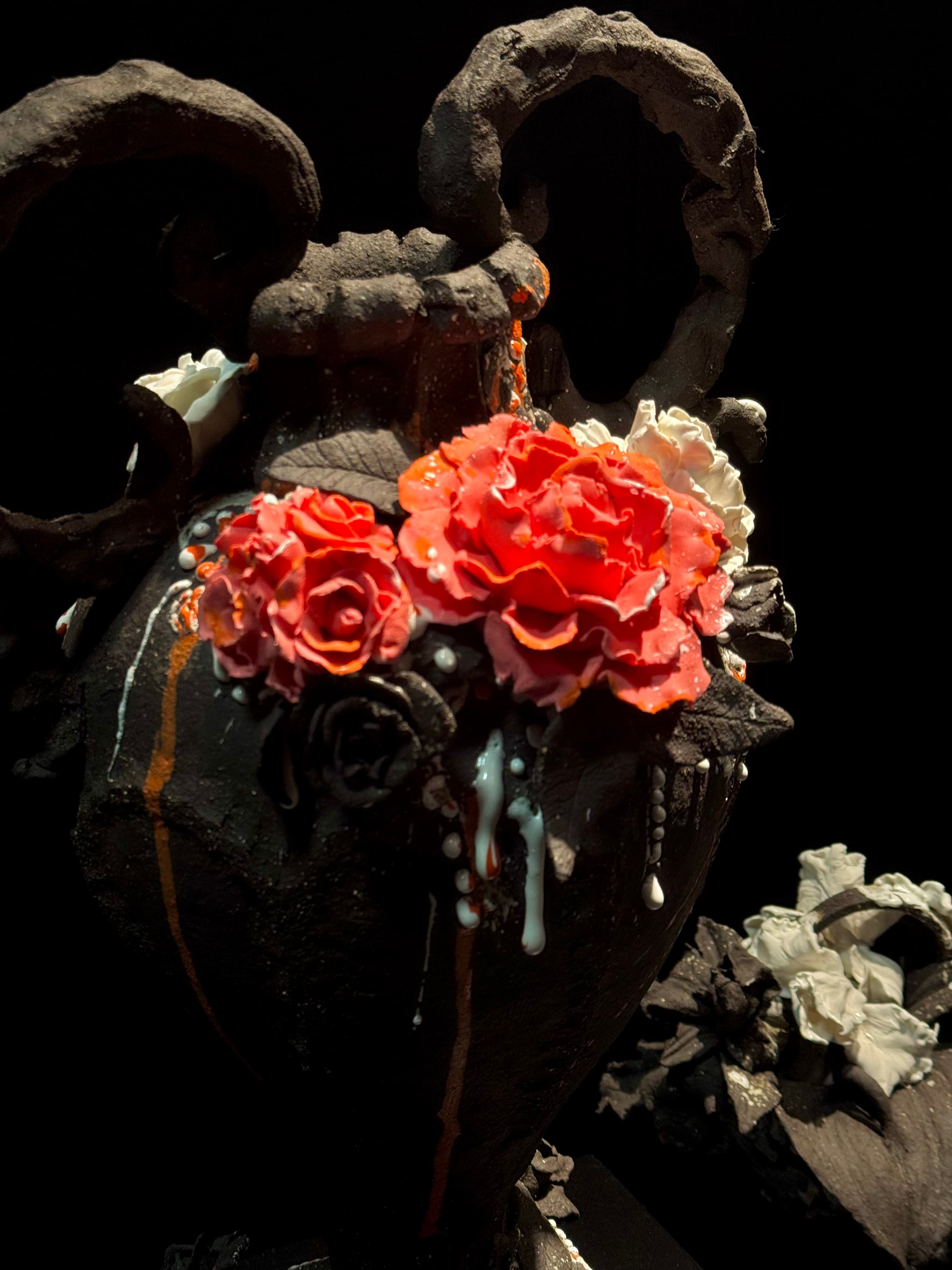 A Vulcanic Rococo piece: dark stoneware with porcelain roses